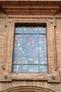 Stained glass window of Chiesa di San Cristoforo is church located on Piazza Tolomei. Siena. Italy