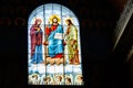 Stained glass window depicting Jesus, Virgin Mary and St. John the Baptist Royalty Free Stock Photo