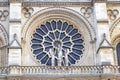 Stained glass window in facade of Notre dame cathedral.  North Rose window at Notre Dame cathedral dates from 1250 and is also 12. Royalty Free Stock Photo