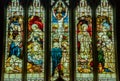 Stained glass window illustrated Bible stories in the Christ Church
