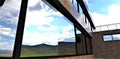 Stained glass window of a modern low-rise office made of natural brown bricks. Reflection of a mountain ecologically clean