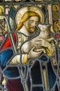 Stained glass window showing Jesus holding a lamb Royalty Free Stock Photo