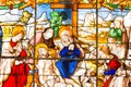 Stained glass window on which the scene mourning Jesus Christ. Made in bright and beautiful colors