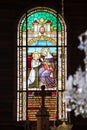 Stained glass window in wooden church of St. Anna in Tatranska Javorina, Slovakia