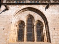 Ogival arch on the facade of a cathedral with religious stained glass Royalty Free Stock Photo