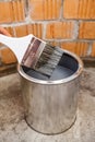 Stained grey color paint brush over can Royalty Free Stock Photo