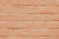 Stained old stucco orange painted brick wall background, aged masonry texture Royalty Free Stock Photo