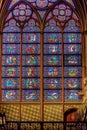 Stained patterns on glass of the window in the Notre-Dame de Paris before the big fire, a medieval Catholic cathedral on the Ile Royalty Free Stock Photo