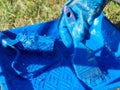 Stained tray and paint brush in blue paint. Hand of industrial painter in stained glove holds paint brush over paint Royalty Free Stock Photo