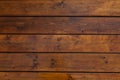 Stained wet deck wooden boards with water drops texture