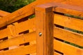 Stained yellow pine wooden guard rail and balustrade.