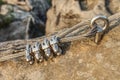 Stainless cable fixed to the rock for the safety Royalty Free Stock Photo