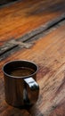 stainless coffee cup on wood table in outdoor. copy space on the top