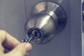 Stainless door knob on white door. Royalty Free Stock Photo