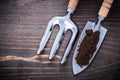 Stainless hand spade with soil and trowel fork on