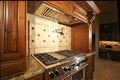 Stainless kitchen oven range and hood Royalty Free Stock Photo