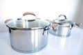 Stainless pots on a white background Royalty Free Stock Photo