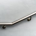 Stainless railing on white wall Royalty Free Stock Photo