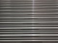 Stainless Steel background with a streak of light Royalty Free Stock Photo