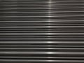 Stainless Steel background with a streak of light Royalty Free Stock Photo