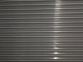 Stainless Steel background with a streak of light Royalty Free Stock Photo