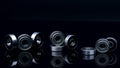 Stainless steel ball bearing on balck backgroud. Set of thrust ball bearing and silver ball bearing. Spare parts for roller