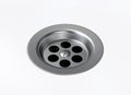 Stainless steel bathroom sink hole on white background