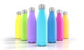 Stainless steel bottles with different colors on a white background