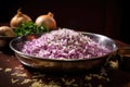 stainless steel bowl filled with finely chopped onions