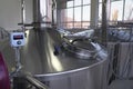 Stainless steel brewing equipment : large reservoirs or tanks and pipes in modern beer factory. Brewery production concept, Royalty Free Stock Photo