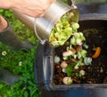 Stainless Steel Compost Bin with Various Food Scraps Royalty Free Stock Photo