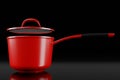 Stainless steel cooker with lid and chrome cookware on black background Royalty Free Stock Photo