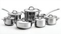 Stainless steel cookware set with pots and pans on white background Royalty Free Stock Photo