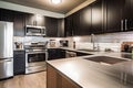 stainless steel countertops and sleek black appliances in the kitchen