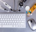 Stainless steel desktop with medical doctor equipment and computer technology Royalty Free Stock Photo