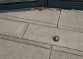 stainless steel door stop. concrete tile with rubber post in the shape of a