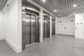 Stainless steel elevator bank in the lobby of Royalty Free Stock Photo