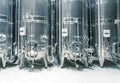 Stainless steel fermentation tanks in modern wine factory Royalty Free Stock Photo