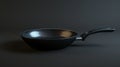 Stainless Steel Frying Pan With Handle on Black Background