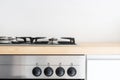 Gas stove and control panel of electric oven at modern kitchen Royalty Free Stock Photo