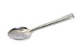 Stainless steel glossy metal kitchen spoon isolated over the white background Royalty Free Stock Photo