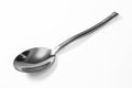 Stainless steel glossy metal kitchen spoon isolated Royalty Free Stock Photo