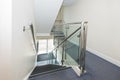 Stainless steel handrail and glass panels on staircase