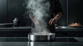 a stainless steel hotpot brimming with sizzling hot oil, highlighting the harmony of flavors and textures.