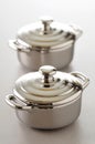 Stainless steel individual cooking pots Royalty Free Stock Photo