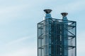 Stainless steel industrial chimneys with protective grid mesh