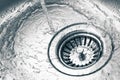 A stainless steel kitchen sink drain Royalty Free Stock Photo