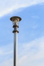 Stainless steel lamp pole at the road on blue sky Royalty Free Stock Photo