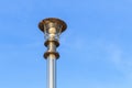 Stainless steel lamp pole at the road on blue sky Royalty Free Stock Photo