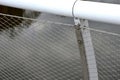 stainless steel mesh stretched on the bridge railing. the lower steel rope serves Royalty Free Stock Photo